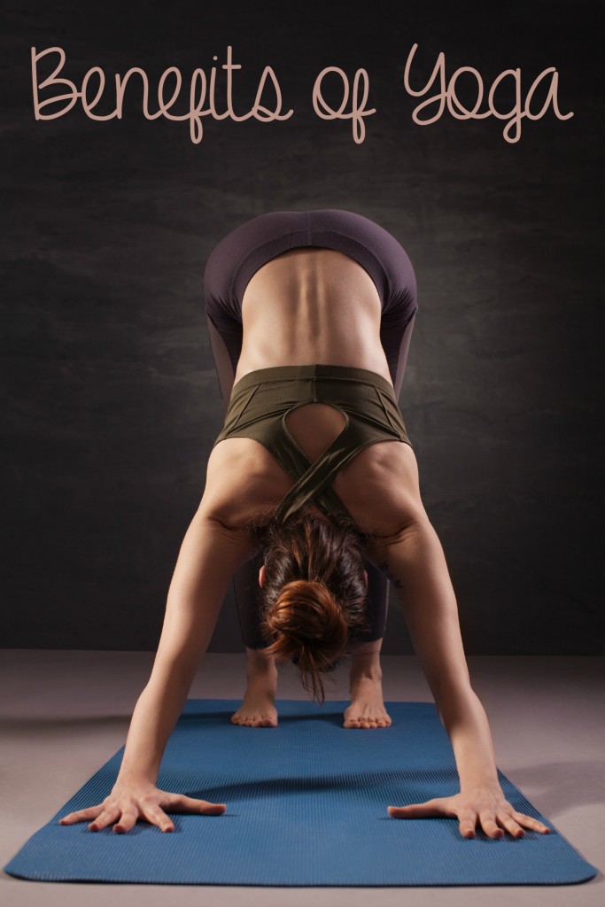 Mature woman practicing yoga on the floor. Studio shoot