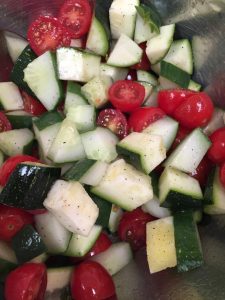 This Cherry Tomato Cucumber Salad would be great to have for Memorial Day.  It is easy to throw together and travels well.  It also has some fun things in the salad like zucchini and oregano.  Mmmm.  The fresh veggies are such a welcome thing to bite into in the spring.