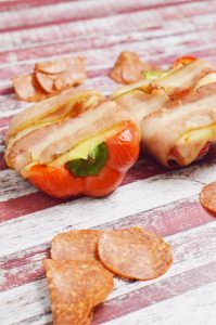I love stuffed peppers!  Here is a new way to make them - Pizza Stuffed, Bacon Wrapped Peppers!   Yes they are dairy and gluten free!