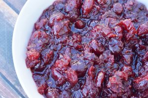 Make your holiday pop with this tangy Homemade Cranberry Sauce!   I absolutely love using fresh cranberries to make sauces and this homemade cranberry sauce is so yummy as any side dish.  Don't be scared to try making this with fresh berries, it is so easy and so tasty.